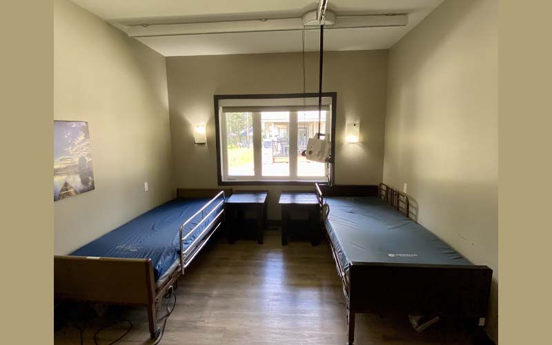 Hospital beds and ceiling track rails for lifts